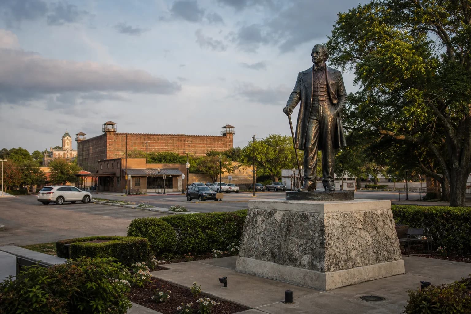 Huntsville Texas downtown with historic prison walls in the distance at late afternoon